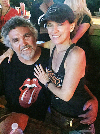 Smiling picture of tMiami.com owners / operators wearing custom printed t-shirt and tank top at Cafe 27